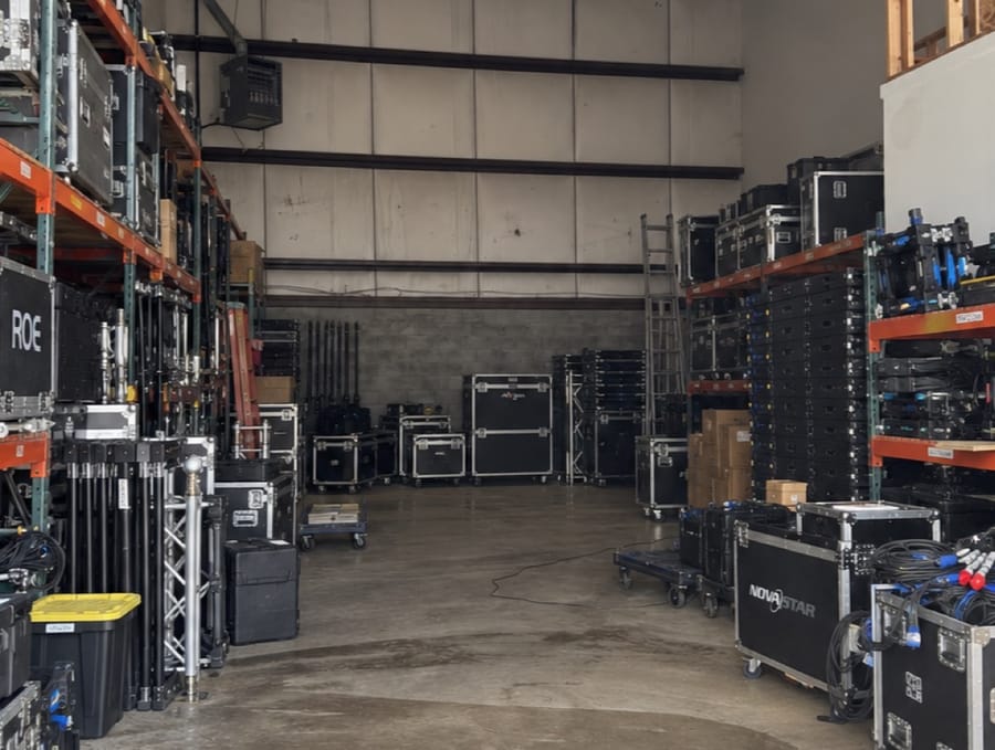 Our North Bergen warehouse: racks of LED panel road cases, truss and NovaStar processing